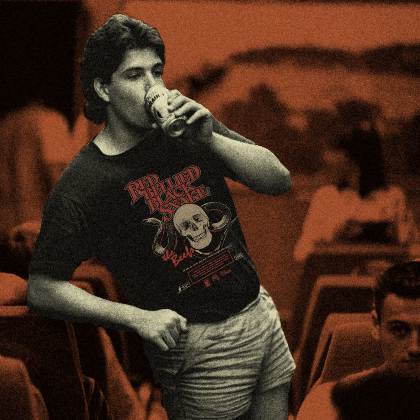 A retro photo of a man having a sip in The Beefs Red Bellied Black Snake t-shirt