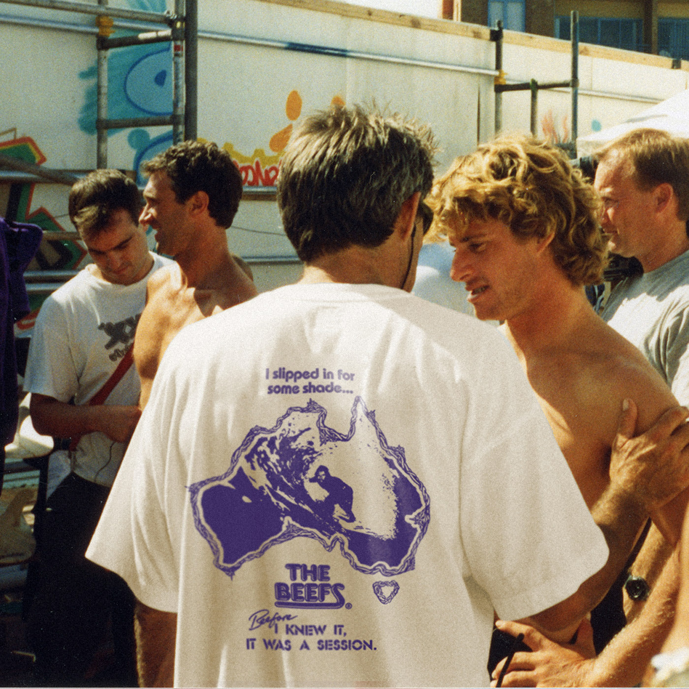 A vintage photo of Occy's surf coach wearing The Beefs Bazza tee