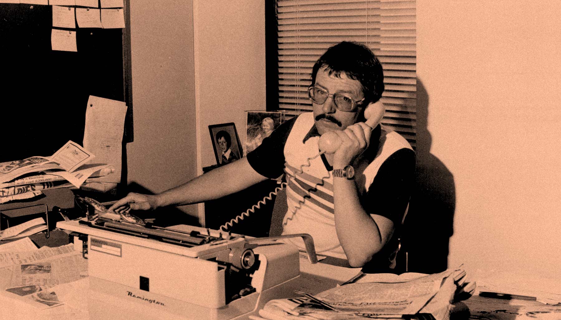 An Australian man from the 1980's doing business in his office